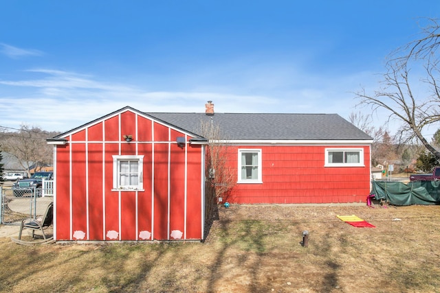 view of outbuilding with an outbuilding and fence