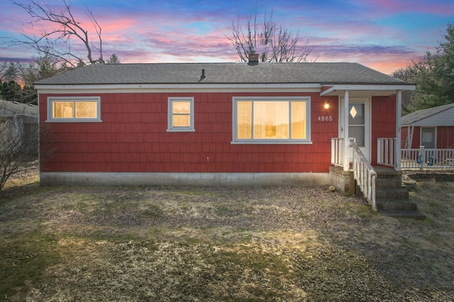 view of front of property with a shingled roof