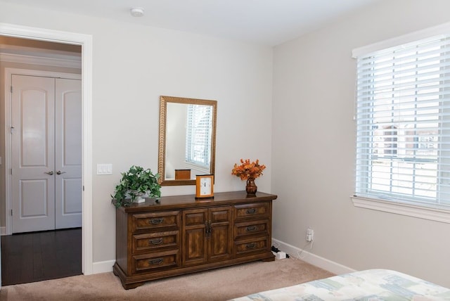 carpeted bedroom with baseboards