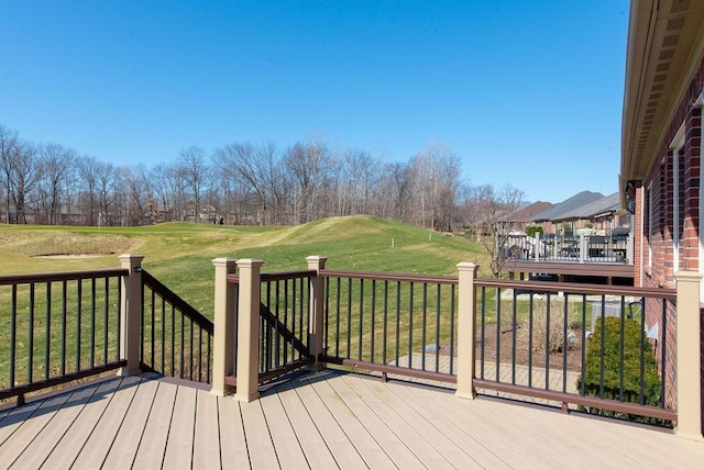 wooden terrace with a lawn