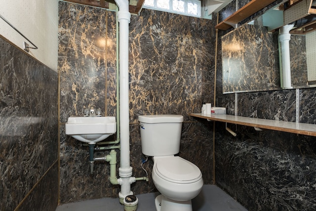 bathroom featuring toilet and a sink