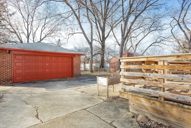 garage with fence