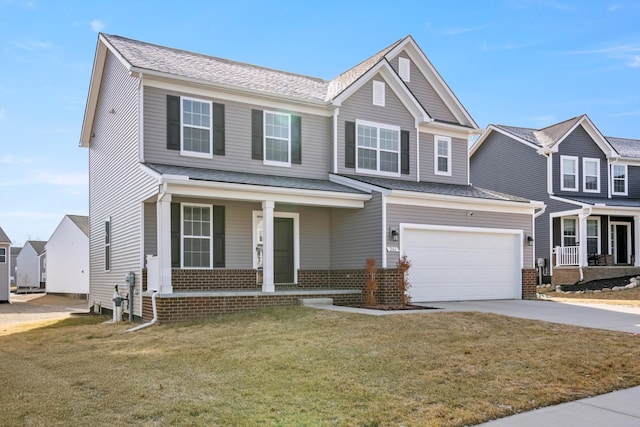 view of front of home featuring brick siding, a porch, driveway, and a front lawn