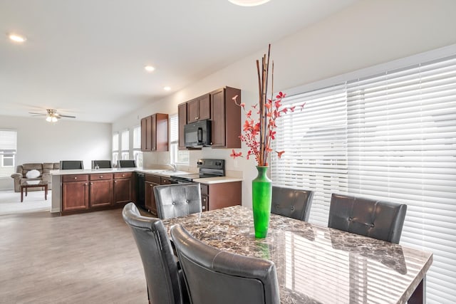 dining space with recessed lighting, ceiling fan, and light wood finished floors