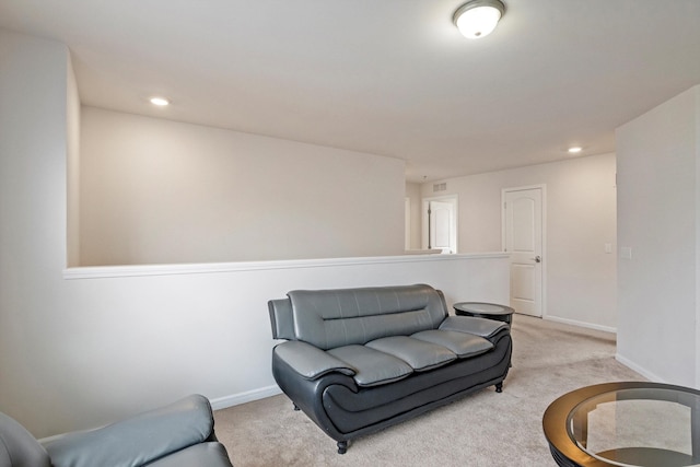 sitting room featuring recessed lighting, light colored carpet, visible vents, and baseboards