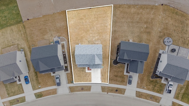 birds eye view of property with a residential view