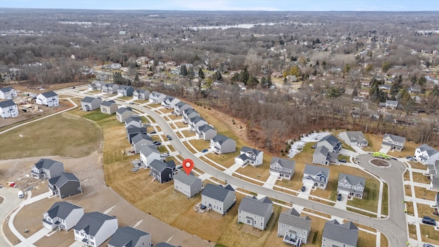 birds eye view of property with a residential view