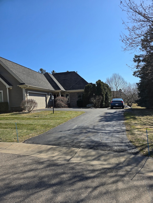 view of road with driveway