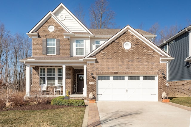 traditional-style home with roof with shingles, driveway, a porch, brick siding, and an attached garage