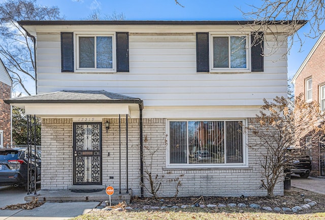 view of front of house featuring brick siding