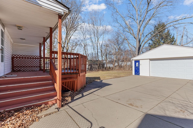 exterior space featuring a detached garage and an outdoor structure