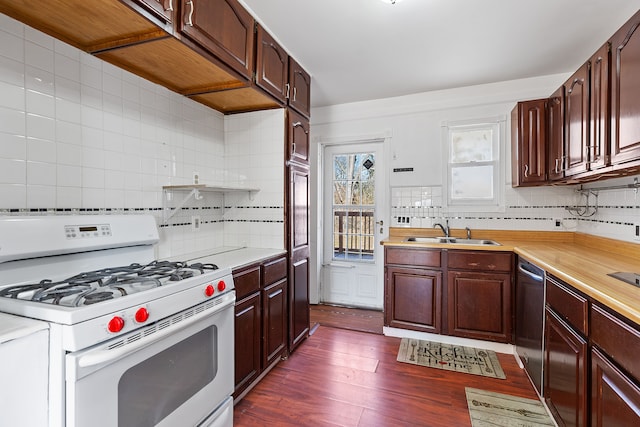 kitchen featuring a sink, white range with gas stovetop, stainless steel dishwasher, and light countertops