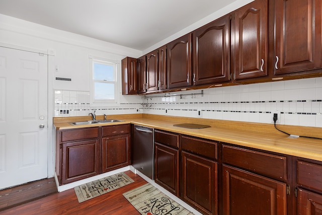 kitchen with tasteful backsplash, dishwasher, light countertops, dark wood-style floors, and a sink