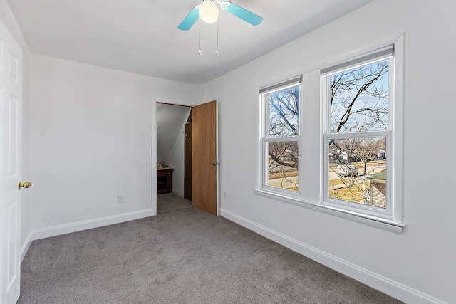 unfurnished bedroom featuring baseboards, carpet floors, and a ceiling fan