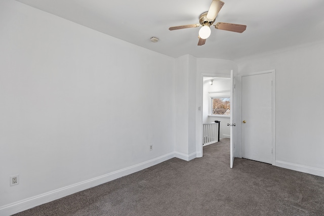 unfurnished bedroom with baseboards, carpet floors, and ceiling fan