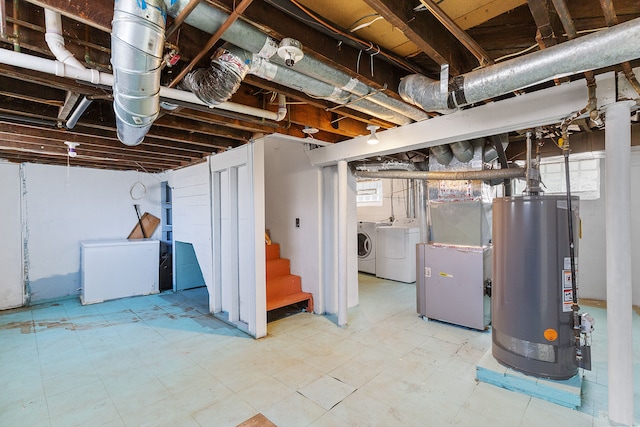 below grade area featuring gas water heater, stairs, tile patterned floors, fridge, and separate washer and dryer