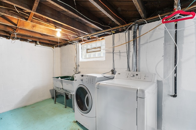 clothes washing area featuring laundry area and washing machine and clothes dryer