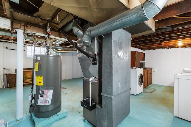 basement featuring heating unit, independent washer and dryer, and water heater