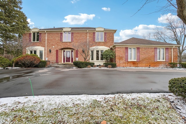 townhome / multi-family property featuring brick siding