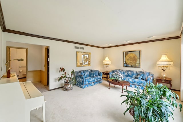 carpeted living room featuring visible vents, baseboards, and crown molding