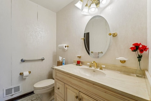 half bathroom featuring vanity, toilet, visible vents, and tile patterned flooring