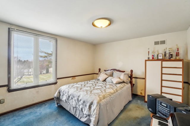 carpeted bedroom with baseboards and visible vents