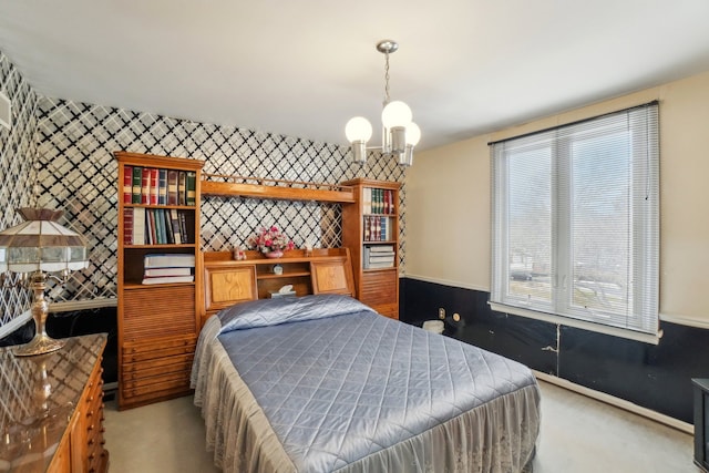 bedroom featuring carpet, an inviting chandelier, and wallpapered walls