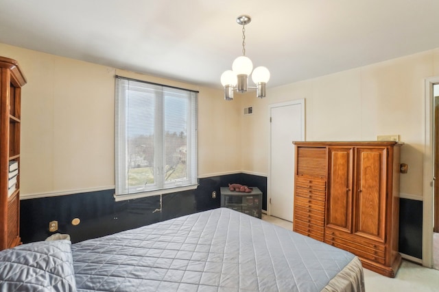 bedroom featuring a notable chandelier, visible vents, and carpet floors