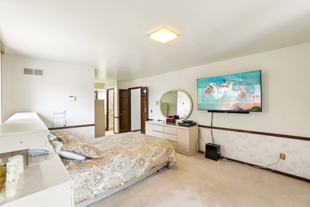 bedroom with wallpapered walls, visible vents, and light carpet