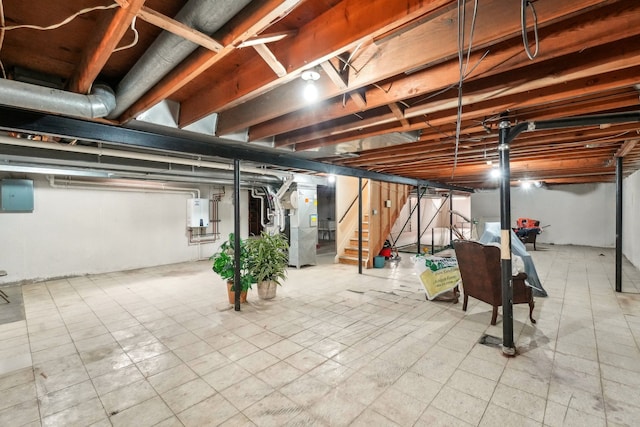 unfinished basement with stairs, tile patterned floors, electric panel, and heating unit