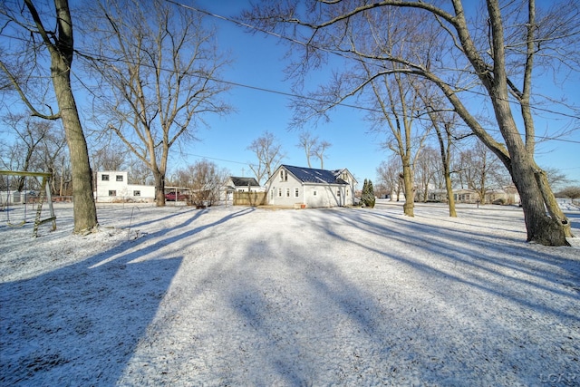 view of yard featuring gravel driveway and fence