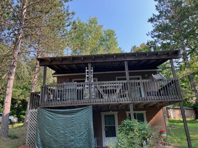 back of property featuring a wooden deck