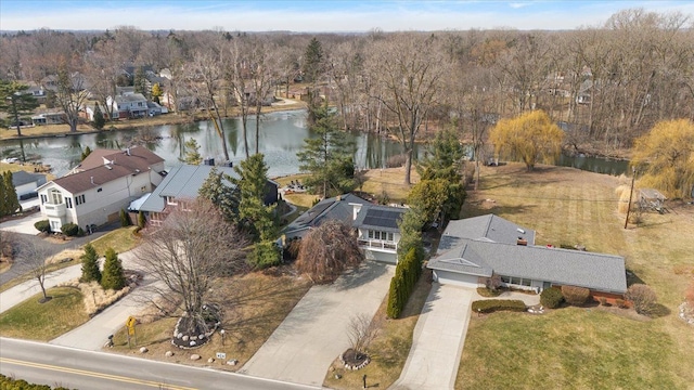 birds eye view of property featuring a residential view and a water view