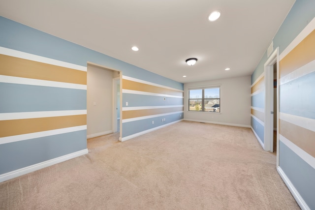 unfurnished room with carpet flooring, recessed lighting, and baseboards