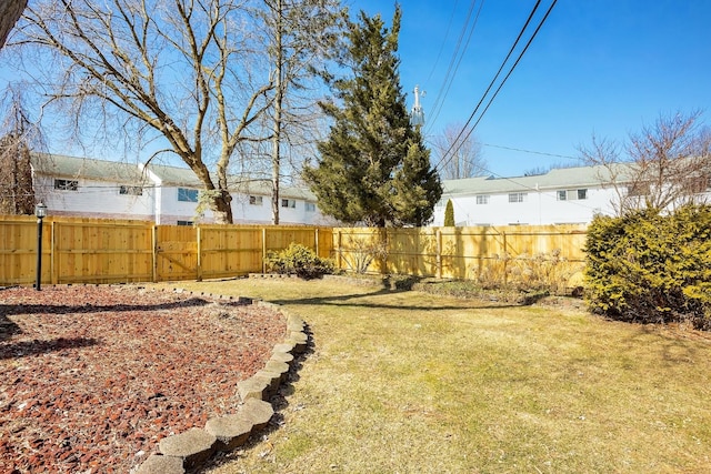 view of yard with a gate and fence