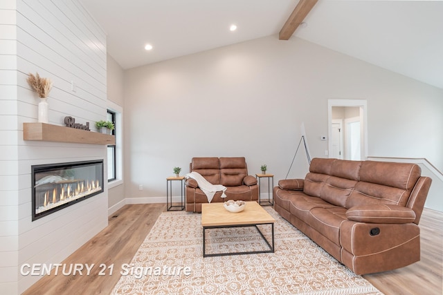 2289 Holly Ridge Ln, Bay City, MI 48706 - living area with wood finished floors, beamed ceiling, a fireplace, recessed lighting, and high vaulted ceiling