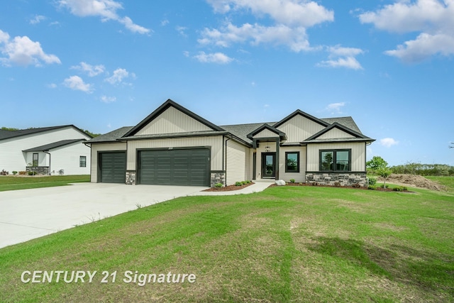 2289 Holly Ridge Ln, Bay City, MI 48706 - modern inspired farmhouse with stone siding, board and batten siding, an attached garage, concrete driveway, and a front yard