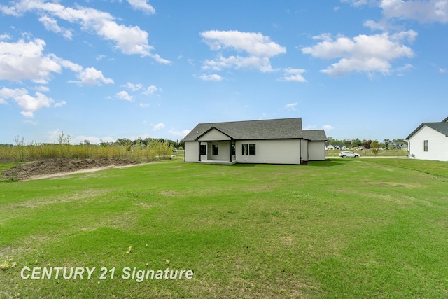 2289 Holly Ridge Ln, Bay City, MI 48706 - back of property featuring a yard