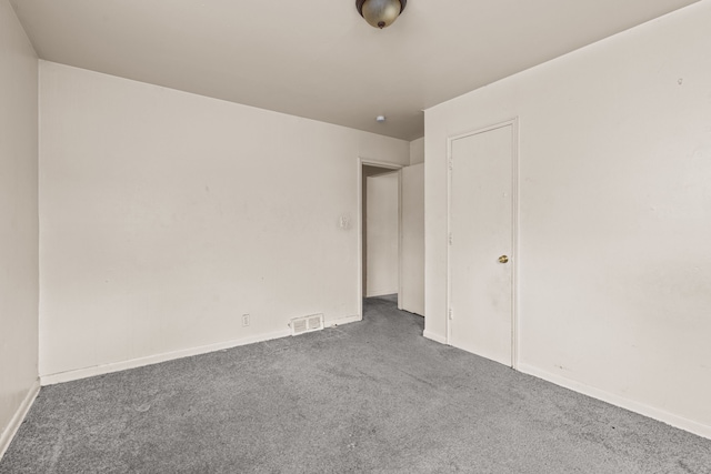 unfurnished bedroom featuring visible vents, baseboards, and carpet