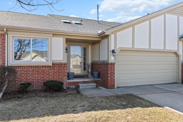 view of front of property featuring brick siding, concrete driveway, a garage, and a shingled roof