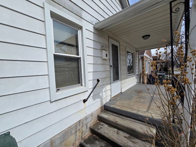 doorway to property featuring covered porch