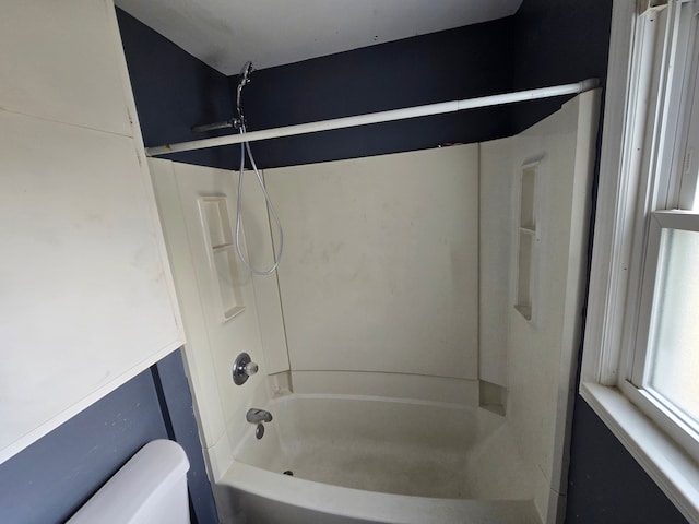 full bathroom featuring toilet and bathing tub / shower combination