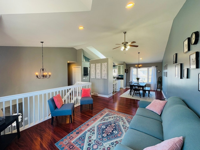 living area featuring baseboards, lofted ceiling, recessed lighting, ceiling fan with notable chandelier, and wood finished floors