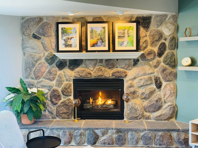 interior details with a stone fireplace