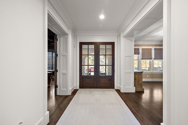 entryway featuring crown molding, french doors, dark wood-type flooring, and baseboards