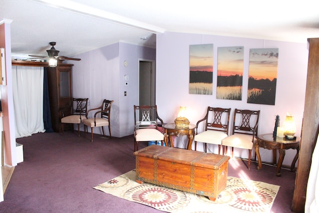 living area with lofted ceiling, carpet flooring, and a ceiling fan