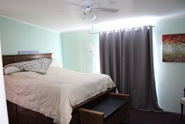 bedroom with ceiling fan and crown molding