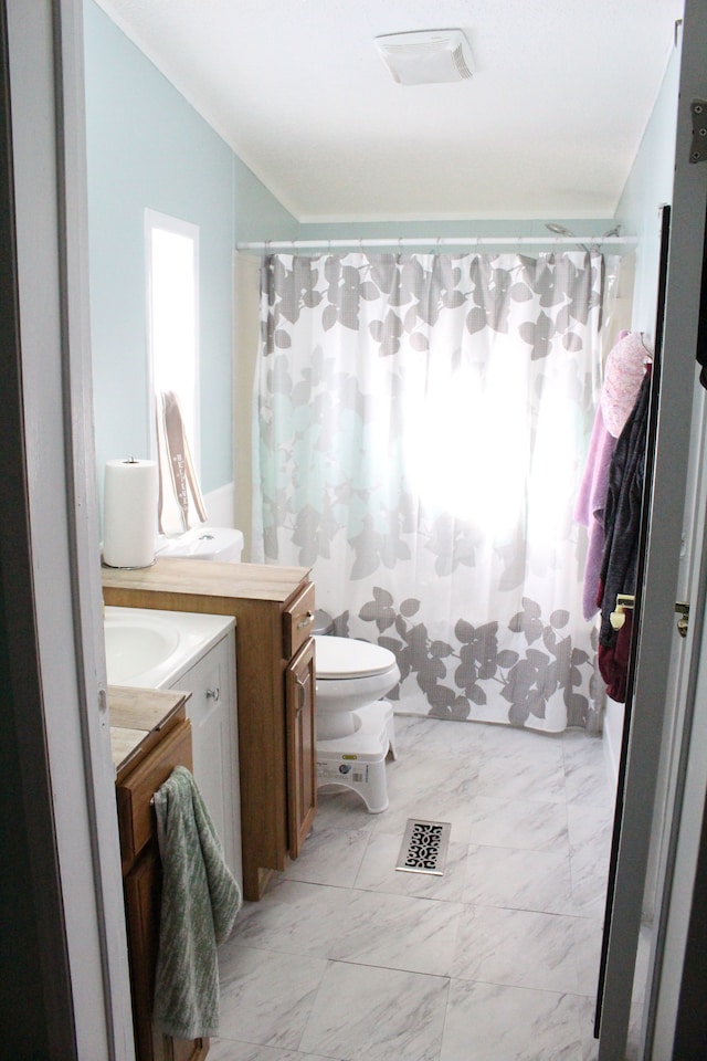 bathroom with vanity, a shower with curtain, visible vents, and marble finish floor