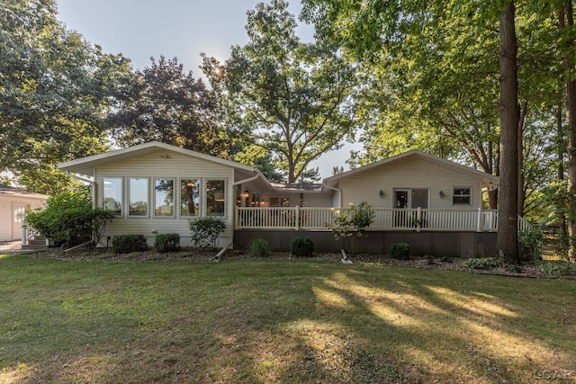 rear view of property with a yard