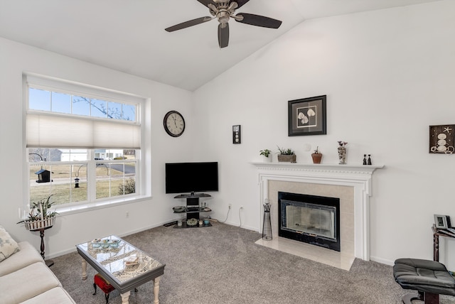 living room featuring baseboards, ceiling fan, carpet floors, a fireplace, and high vaulted ceiling